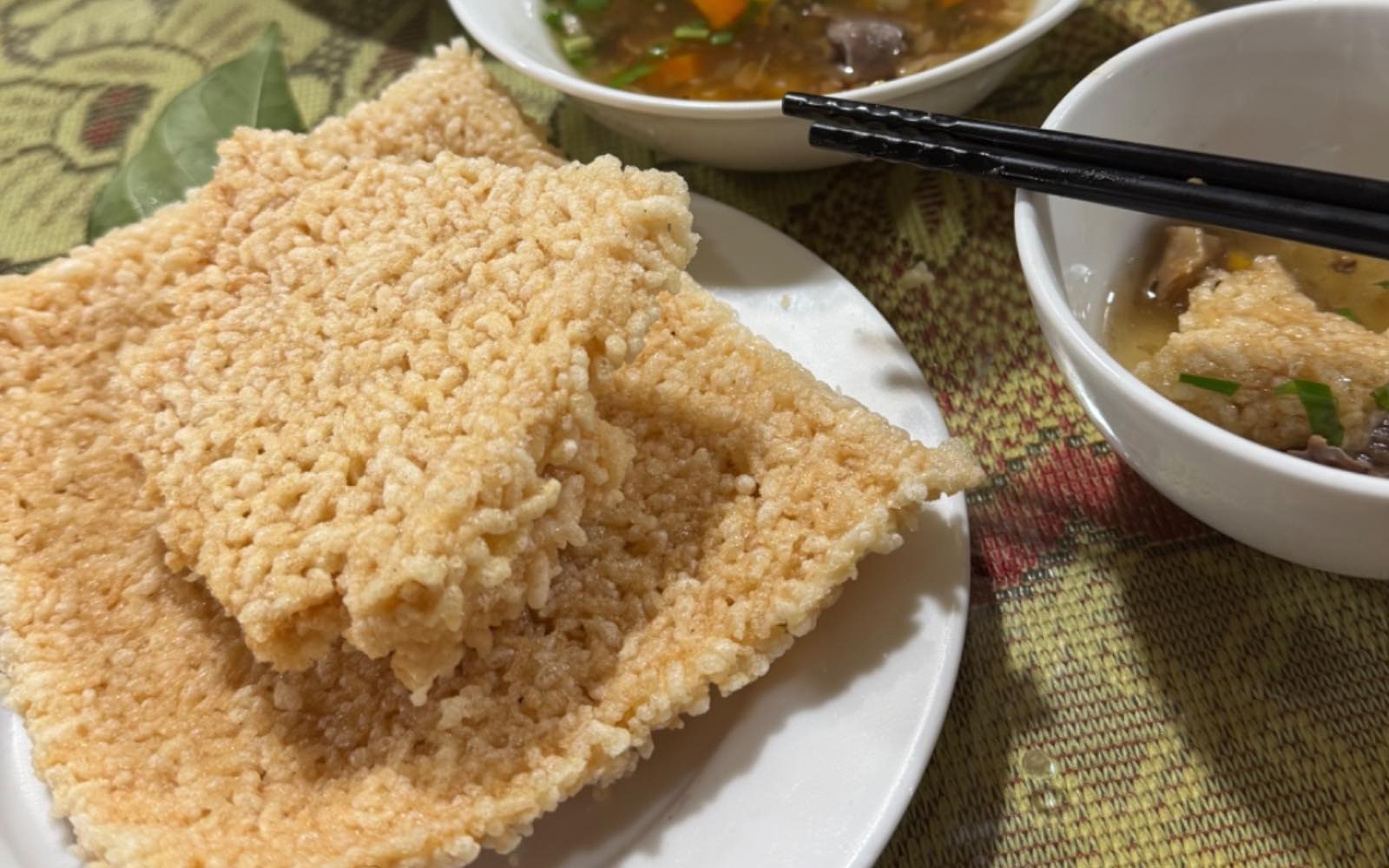 Cơm cháy chấm canh dê (Crispy rice with goat soup)
